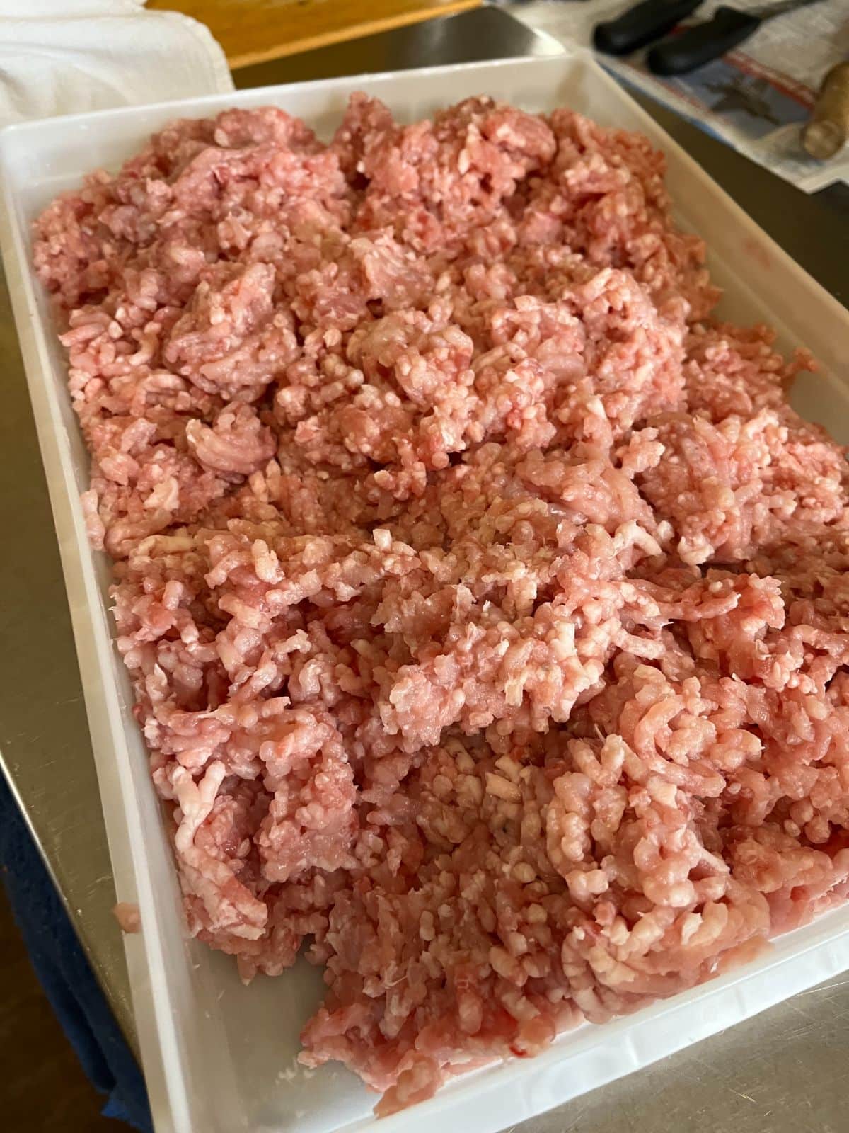 Coarse ground rabbit meat in a tray