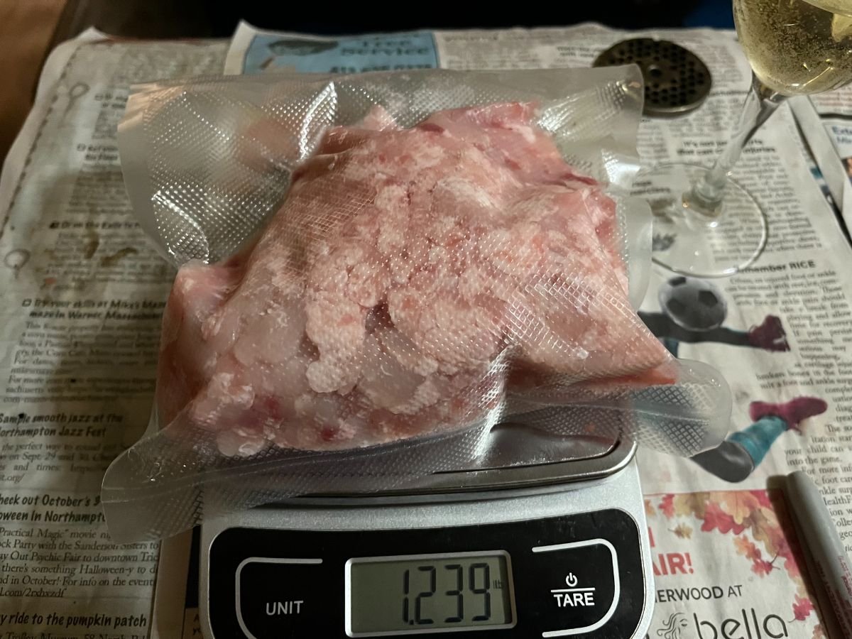 Weighing bags of ground rabbit meat