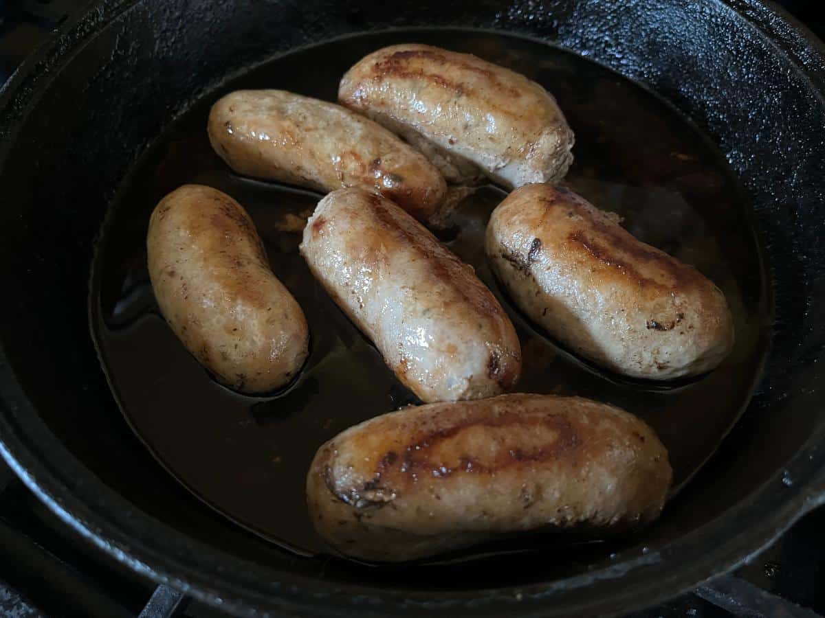 Sweet Italian Rabbit Sausage in a frying pan