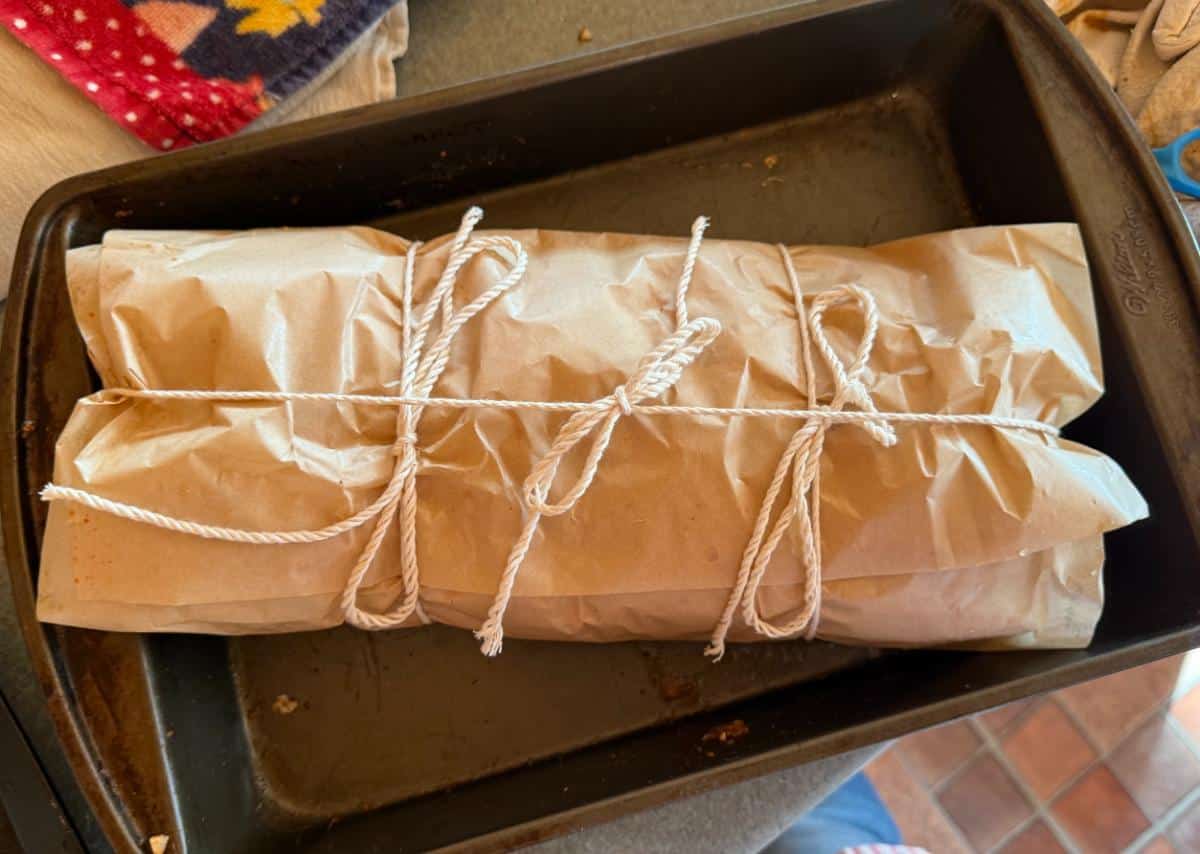 Rabbit meat in parchment returning to the smoker