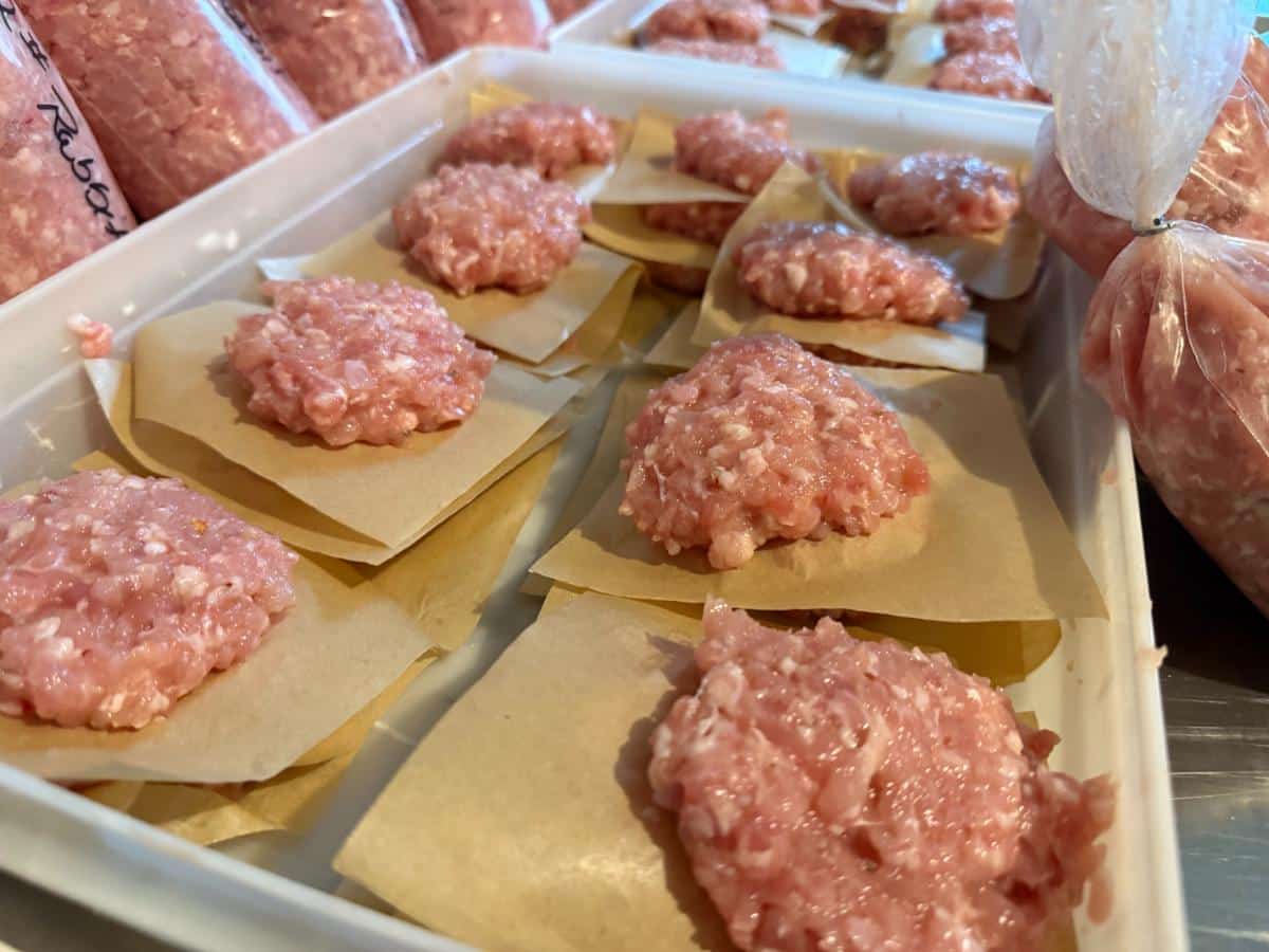 Raw ground meat portions on paper